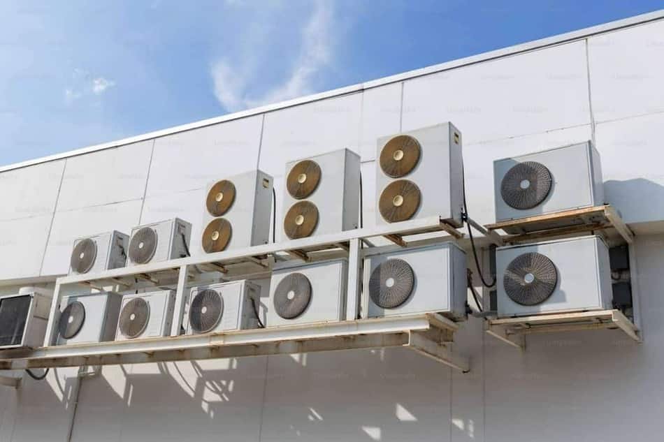 Air conditioning condenser unit being serviced at a home in Meridian, Idaho
