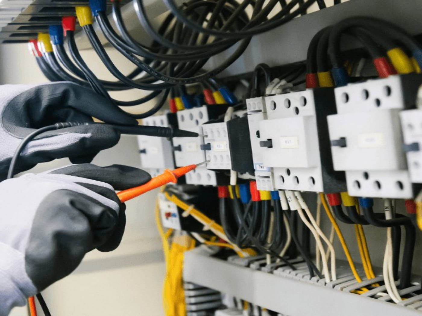 Licensed electrician working on a residential electrical panel in Meridian, Idaho
