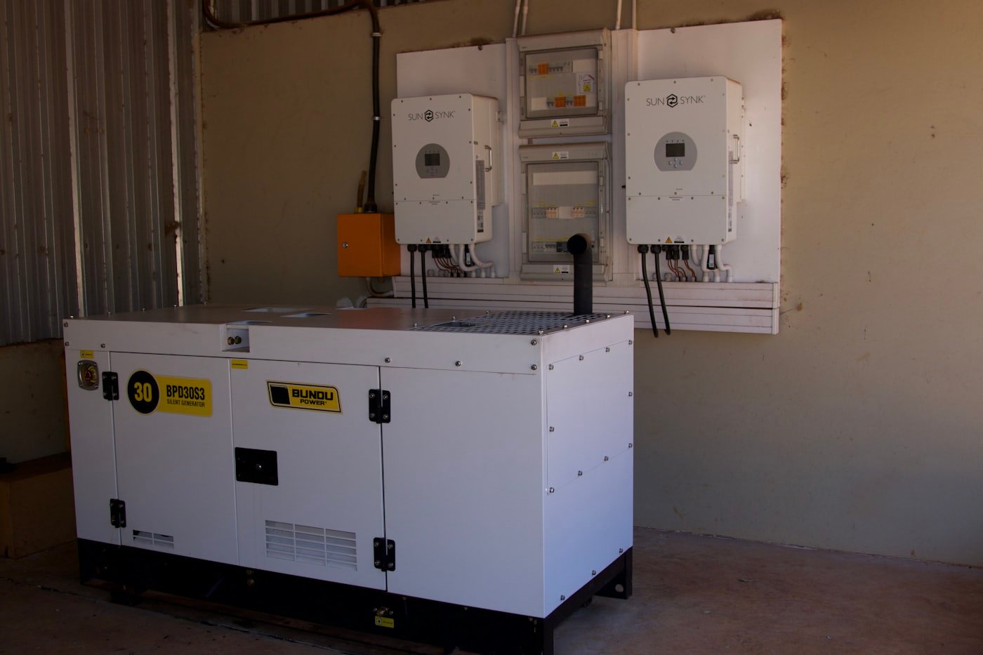 Standby generator on a concrete pad with automatic transfer switch outside a Meridian, Idaho home