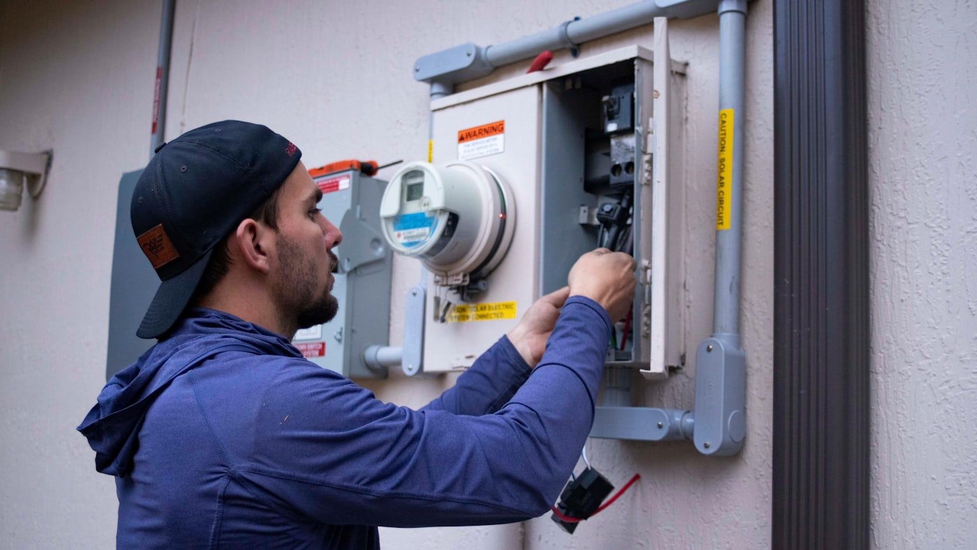 Technician measuring furnace performance during a heating repair in Meridian, Idaho