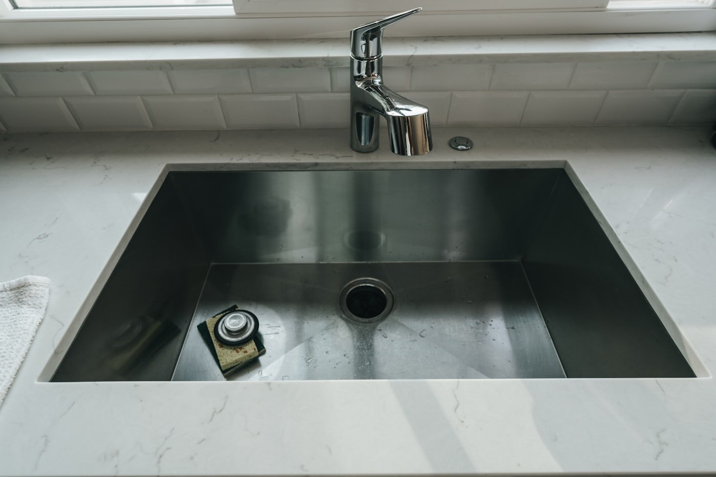 Finished kitchen sink and faucet after plumbing repair in a Treasure Valley home