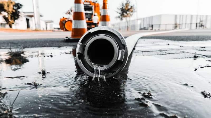 Technician using acoustic leak detection equipment to locate a hidden water leak in Meridian, Idaho