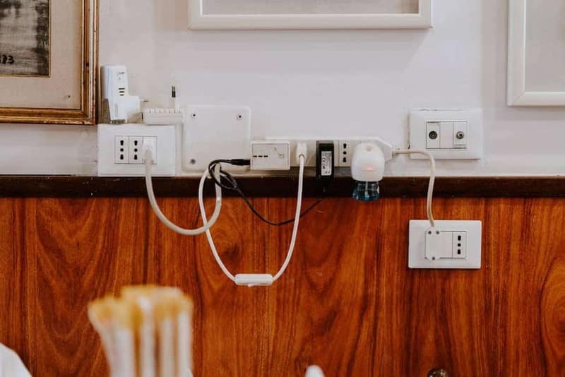 Electrician performing outlet repair in a Meridian, Idaho home