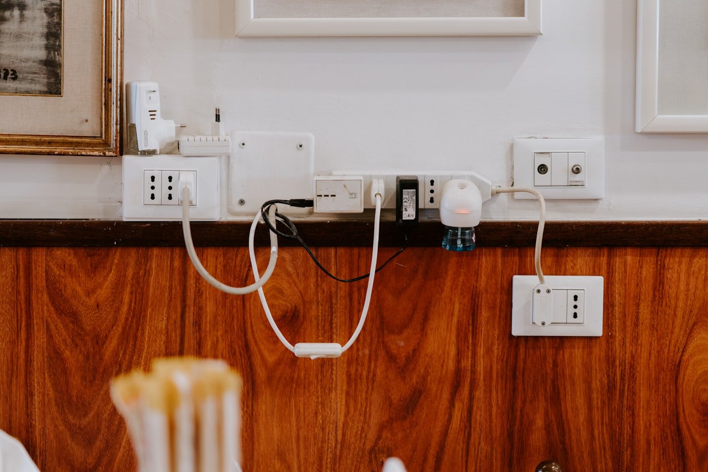 Electrician performing outlet repair in a Meridian, Idaho home