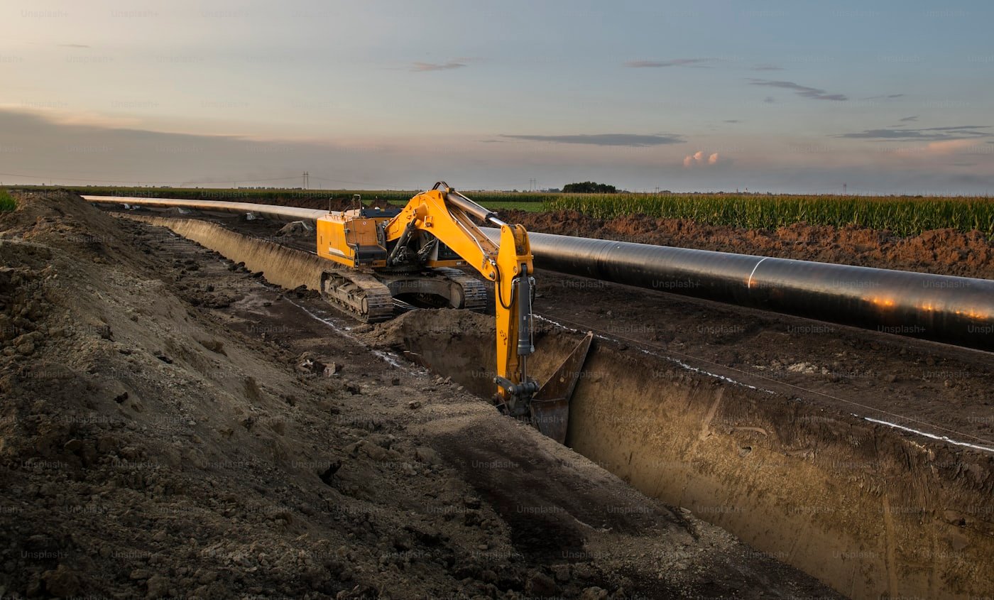 Excavated sewer line being replaced with new pipe outside a Meridian, Idaho home