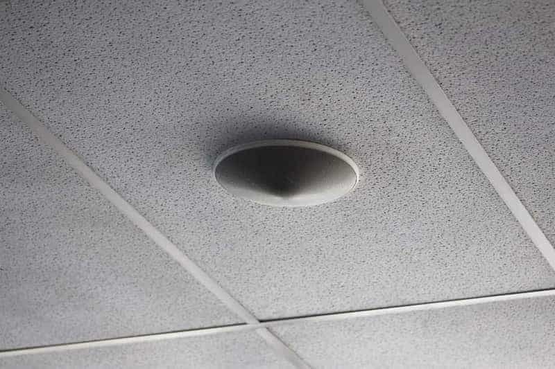 Smoke alarm being replaced on a ceiling in a Meridian, Idaho home