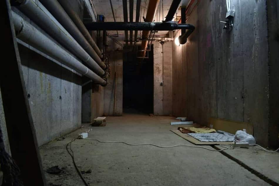 Sump pump installed in a basin with a check valve in a Meridian, Idaho crawl space