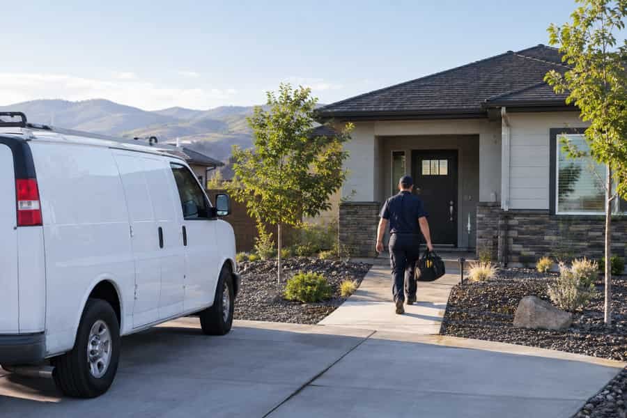 Plumbers in Meridian, Idaho arriving to a home for plumbing, heating and air conditioning service